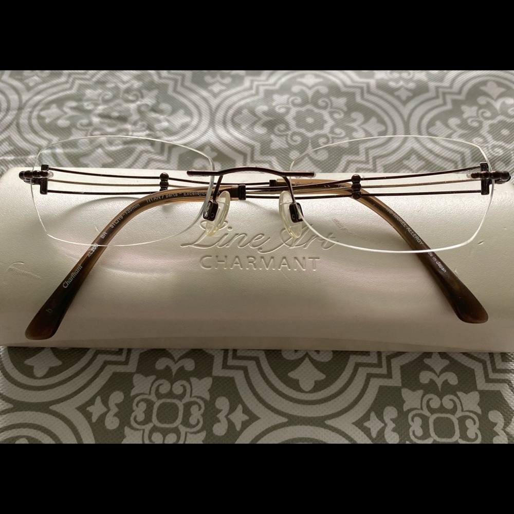 Charmant rim less eye glasses
